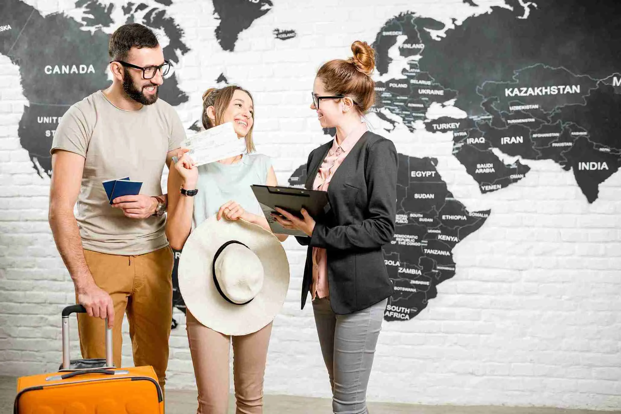 couple-with-travel-agent-at-the-office-2022-04-07-12-58-22-utc_11zon.webp